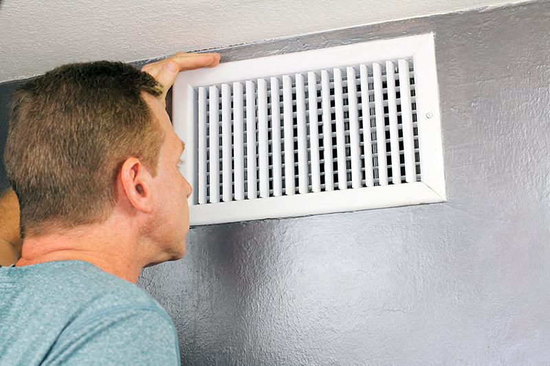 Why Schedule Air Conditioning Maintenance? Vent on a wall.